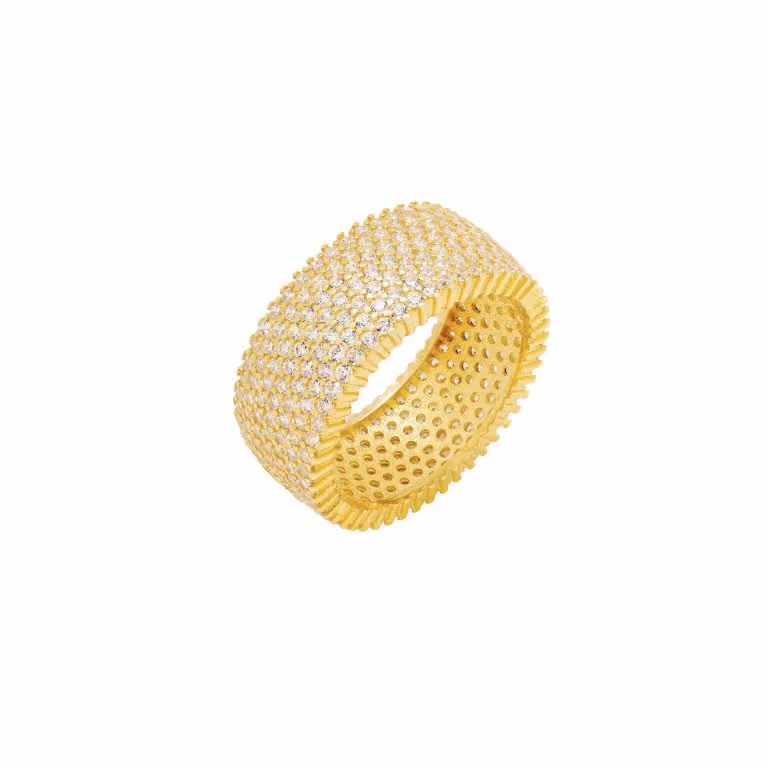 Gold pavé band ring photographed close on a white background