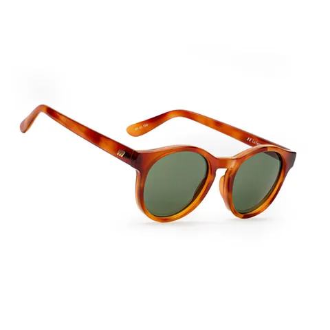 Tortoiseshell sunglasses with green lenses on a white background