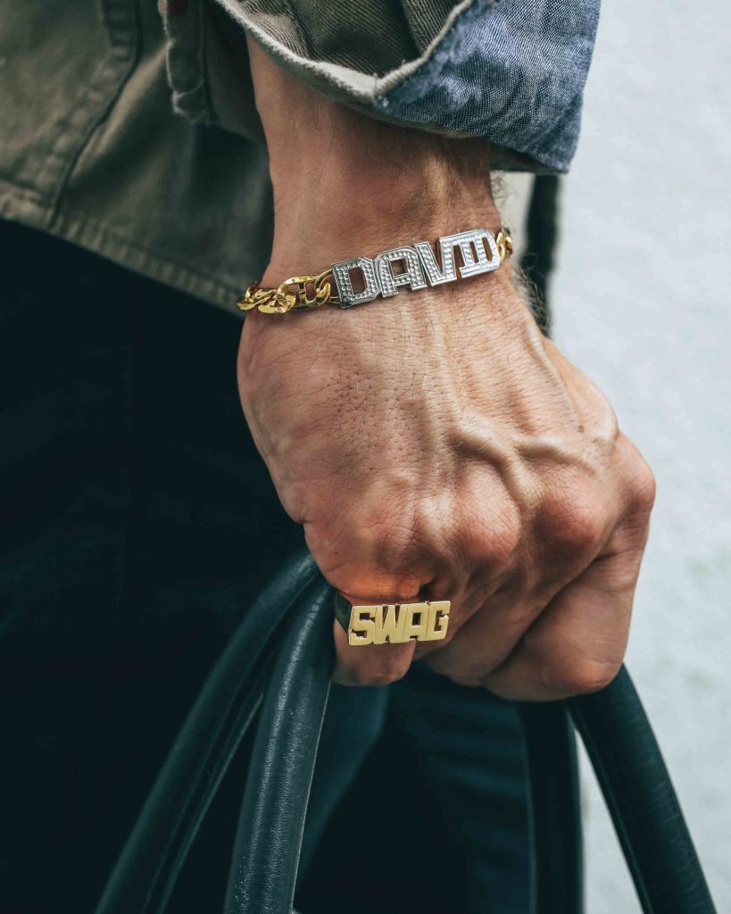 men-bracelet-ring-holding-bag